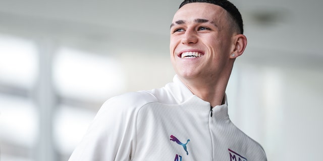 Manchester City's Phil Foden smiles during a recovery session following a victory over Sporting Lisbon in the Champions League Feb. 16, 2022, in Lisbon, Lisboa.