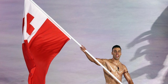 Flag-bearer Pita Taufatofua of Tonga leads the team during the Opening Ceremony of the PyeongChang 2018 Winter Olympic Games at PyeongChang Olympic Stadium on Feb. 9, 2018, in Pyeongchang-gun, South Korea.