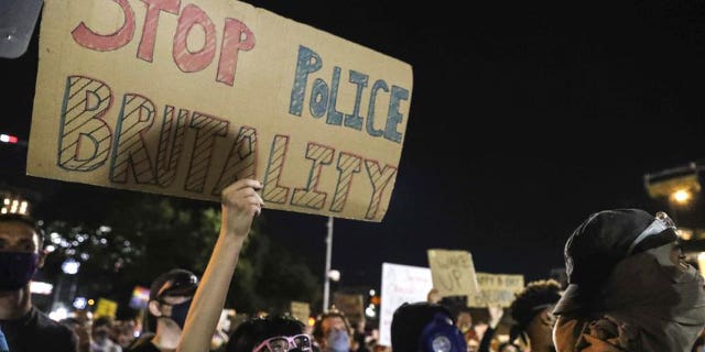 Protesters decry the death of George Floyd, Michael Ramos and police brutality against Black Americans in front of the Austin Police Department headquarters in Austin on June 5, 2020. The Austin City Council on Thursday, Feb. 17, 2022, approved paying a combined $10 million to two people injured when officers fired beanbag rounds into crowds during the 2020 social justice protests, including a college student who suffered brain damage. (Lola Gomez/Austin American-Statesman via AP, File)
