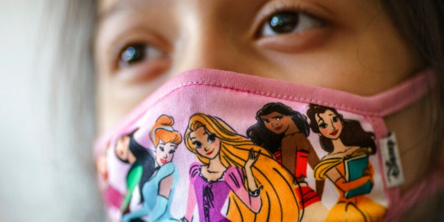 A student wears a mask during class at Raices Dual Language Academy, a public school in Central Falls, R.I., Wednesday, Feb. 9, 2022. (AP Photo/David Goldman)