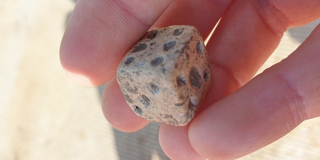 Roman lead die uncovered during archaeological excavations at Fleet Marston, near Aylesbury, Buckinghamshire. Excavations took place during 2021.