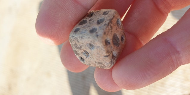 Roman lead die uncovered during archaeological excavations at Fleet Marston, near Aylesbury, Buckinghamshire. Excavations took place during 2021.