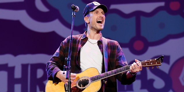 Russell Dickerson performs at the Christmas 4 Kids benefit concert at Ryman Auditorium Nov. 22, 2021, in Nashville, Tenn. 