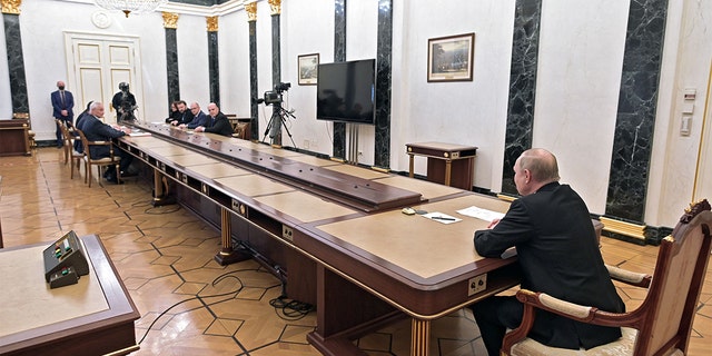 Russian President Vladimir Putin chairs a meeting on economic issues at the Kremlin in Moscow on Feb. 28, 2022.