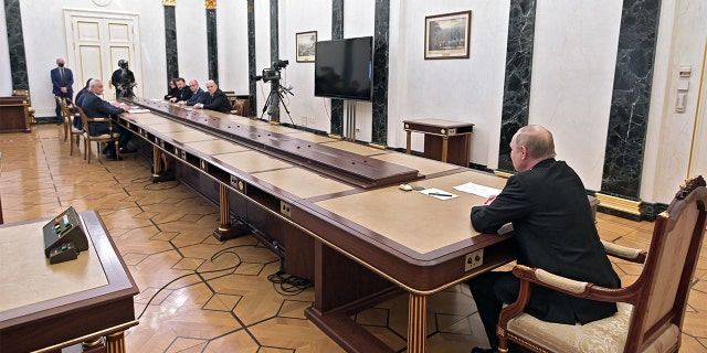 Russian President Vladimir Putin chairs a meeting on economic issues at the Kremlin in Moscow on Feb. 28, 2022.