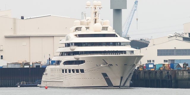 The luxury yacht Dilbar, which was delivered to a Russian billionaire in 2016, is moored at the Blohm+Voss shipyard on Oct. 30, 2021, in Hamburg, Germany.