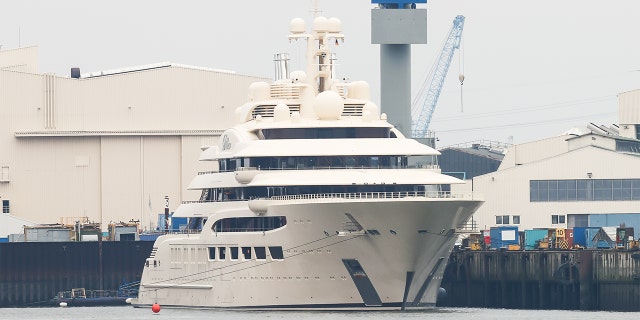 The luxury yacht Dilbar, which was delivered to a Russian billionaire in 2016, is moored at the Blohm+Voss shipyard on Oct. 30, 2021, in Hamburg, Germany.