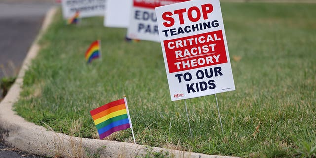 Signs opposing Critical Race Theory line the entrance to the Loudoun County School Board headquarters, in Ashburn, Virginia, U.S. June 22, 2021. (REUTERS/Evelyn Hockstein)