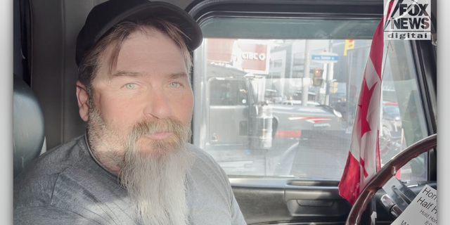 Travis interviews with Fox News Digital inside his truck.