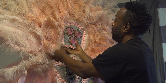 Horace Anderson plans to donate his son's old suit to the Backstreet Cultural Museum.