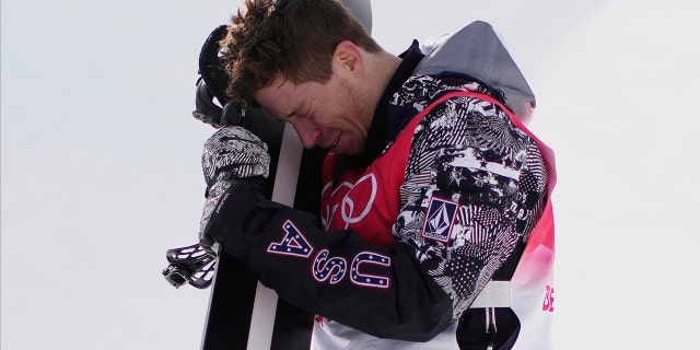 The United States' Shaun White gets emotional after the men's halfpipe finals at the 2022 Winter Olympics Feb. 11, 2022, in Zhangjiakou, China.