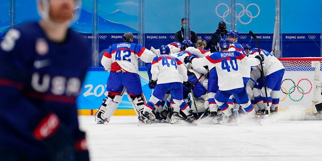 Slovakia's players celebrate after beating the United States 3-2 in a shootout in a men's quarterfinal hockey game at the 2022 Winter Olympics Feb.  16, 2022, in Beijing.