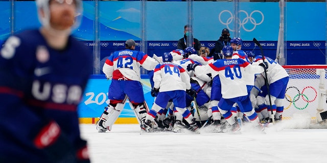 Slovakia's players celebrate after beating the United States 3-2 in a shootout in a men's quarterfinal hockey game at the 2022 Winter Olympics Feb. 16, 2022, in Beijing.