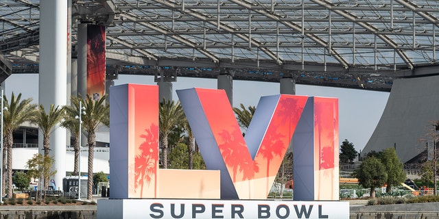 The Super Bowl LVI logo stands outside Sofi Stadium. 
