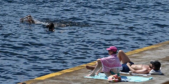 Members of the public are seen in the water at Clovelly Beach in Sydney, Thursday, February 17, 2022.