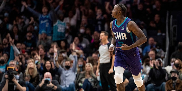 Charlotte Hornets guard Terry Rozier reacts after making a 3-point shot against the Cleveland Cavaliers during the second half of a game in Charlotte, N.C., Friday, Feb. 4, 2022.