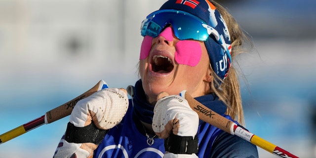 Norway's Therese Johaug react after a gold medal finish during the women's 7.5km + 7.5km skiathlon cross-country skiing competition at the 2022 Winter Olympics, Saturday, Feb. 5, 2022, in Zhangjiakou, China.