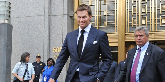 Tom Brady, center, exits federal court in New York on Wednesday, Aug. 12, 2015. 