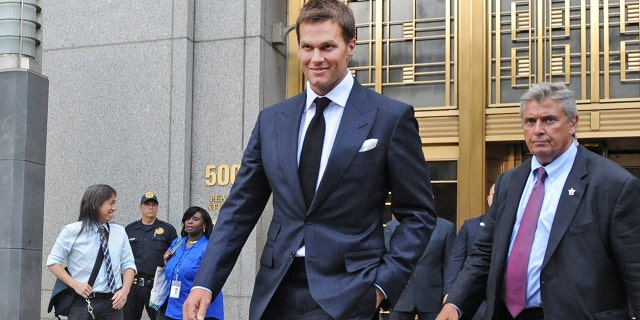 Tom Brady, center, exits federal court in New York on Wednesday, Aug. 12, 2015.