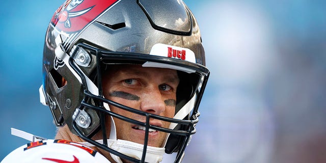 Tom Brady of the Tampa Bay Buccaneers looks on during the second half of a game against the Carolina Panthers at Bank of America Stadium Dec. 26, 2021, in Charlotte, N.C.