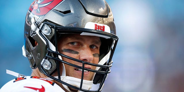 Tom Brady of the Tampa Bay Buccaneers looks on during the second half of a game against the Carolina Panthers at Bank of America Stadium Dec. 26, 2021, in Charlotte, N.C.