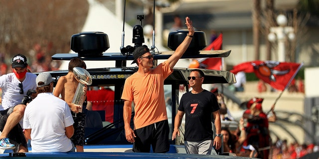 Tampa Bay Buccaneers number 12 Tom Brady celebrates his victory in Super Bowl LV during a boat parade through the city on February 10, 2021 in Tampa, Florida.