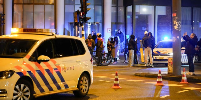 Police vehicles cordon off a wide area in Amsterdam, Netherlands, Tuesday, Feb. 22, 2022.