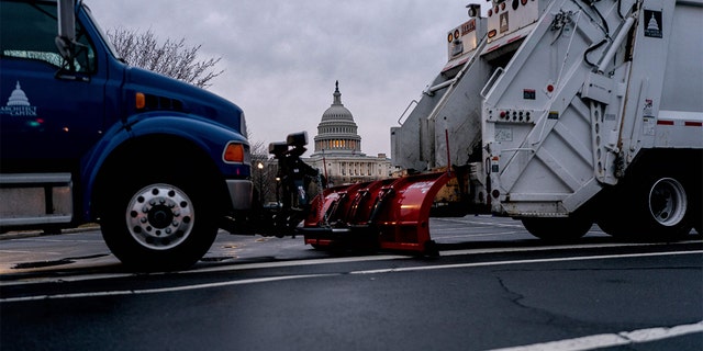 Trucks block a street near the U.S. Capitol in Washington on Feb. 23, 2022, as authorities prepare for the first of three possible truck convoys.