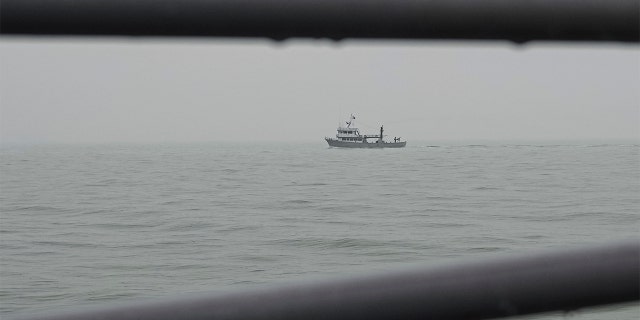 A Ukrainian serviceman mans a heavy machine gun on a military navy ship patrolling the Sea of Azov, waters near Mariupol, Donetsk region, in eastern Ukraine, Wednesday, Feb. 2, 2022. 