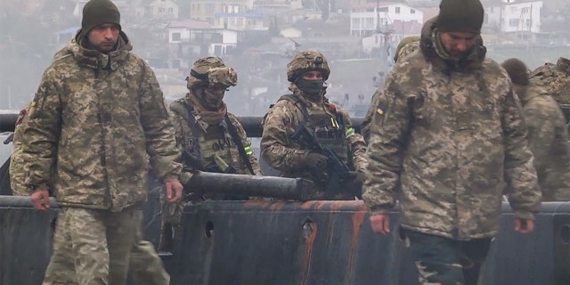 Ukrainian servicemen captured from Zmiinyi Island, or "Snake" Island, were brought to Sevastopol in Crimea, Feb. 26, 2022. Russian media said that the servicemen will be sent back to Ukraine pending certain "legal procedures."