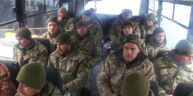 Ukrainian servicemen captured from Zmiinyi Island, or "Snake" Island, were brought to Sevastopol in Crimea, Feb. 26, 2022. Russian media said that the servicemen will be sent back to Ukraine pending certain "legal procedures." (Photo by Russian Defence MinistryTASS via Getty Images)