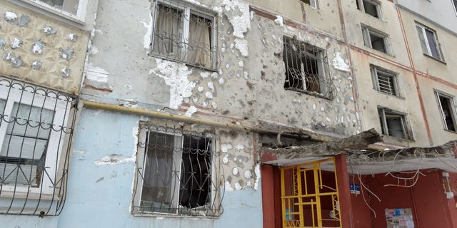 A view of a residential building damaged by recent shelling in Kharkiv on February 26, 2022.