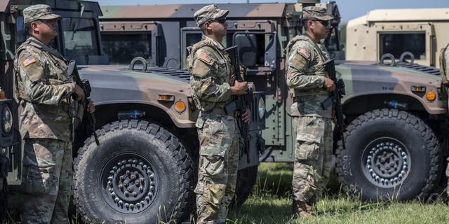 Members of the Texas National Guard during a news conference with Greg Abbott, governor of Texas, not pictured, in Mission, Texas, U.S., on Wednesday, Oct. 6, 2021.