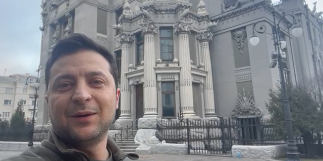 Ukrainian President Volodymyr Zelenskyy posted a video to social media on Saturday morning showing himself walking around the streets of Kyiv after a night of artillery fire in different parts of the city, telling the nation "I'm here."