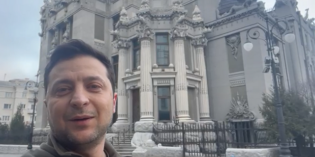 Ukrainian President Volodymyr Zelenskyy posted a video to social media on Saturday morning showing himself walking around the streets of Kyiv after a night of artillery fire in different parts of the city, telling the nation "I'm here."