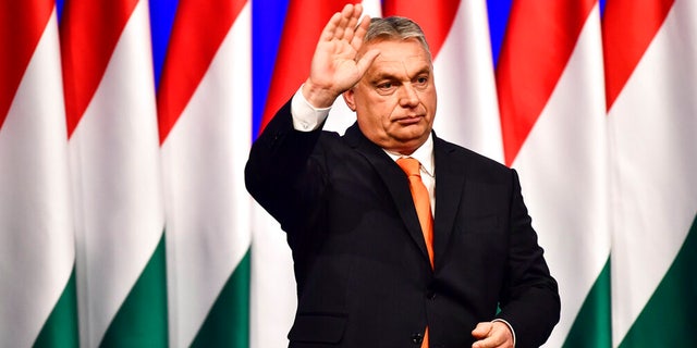 FILE: Viktor Orban waves after his annual state of the nation speech in Varkert Bazaar conference hall of Budapest, Hungary, Feb. 12, 2022.