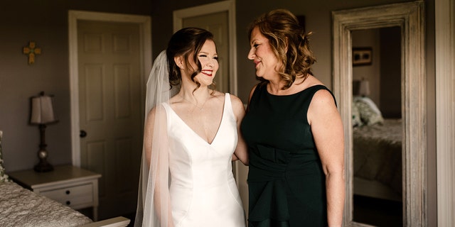 Mother of the bride Kathleen Zemlachenko with daughter Emily, the youngest of her five children, ahead of a very happy day for all.