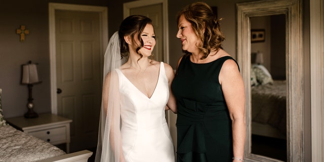 Mother of the bride Kathleen Zemlachenko with daughter Emily, the youngest of her five children, ahead of a very happy day for all.