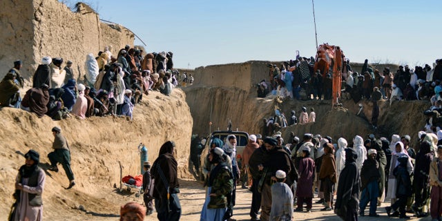 Afghanistan races to rescue stranded boy for 2 days 2 Afghans gather as rescuers try to reach and rescue a boy trapped for two days in a well in a remote village of Shokak in southern Afghanistan. (Photo by Javed TANVEER/AFP) (Photo by JAVED TANVEER/AFP via Getty Images)
