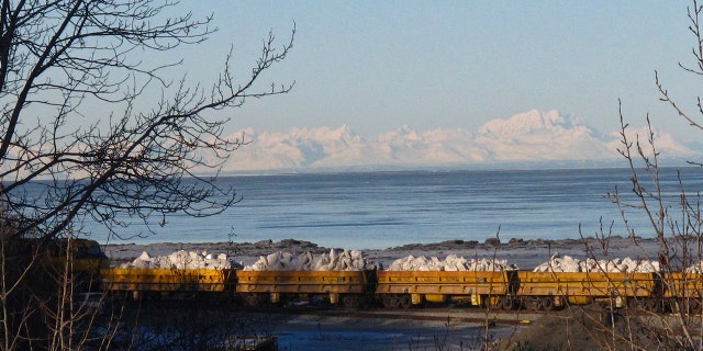 An Alaska Railroad train carries tons of snow in Anchorage, Alaska, on Thursday, March 3, 2016, after traveling 360 miles south from Fairbanks. A Russian lawmaker is demanding the United States return Alaska and a California fort amid crippling sanctions against Moscow.