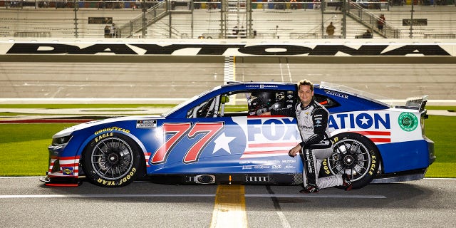 DAYTONA BEACH, FLORIDA - FEBRUARY 16: Landon Cassill, driver of the #77 FOX Nation Chevrolet, poses for a photo on the grid during qualifying for the NASCAR Cup Series 64th Annual Daytona 500 at Daytona International Speedway on February 16, 2022 in Daytona Beach, Florida. (Photo by Jared C. Tilton/Getty Images)