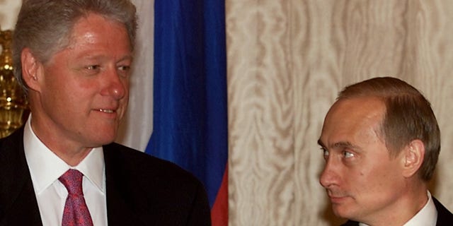 Russian President Vladimir Putin (R) looks at U.S. President Bill Clinton (L) before the start of their second meeting June 4 in Catherine's Hall in the Kremlin. WM