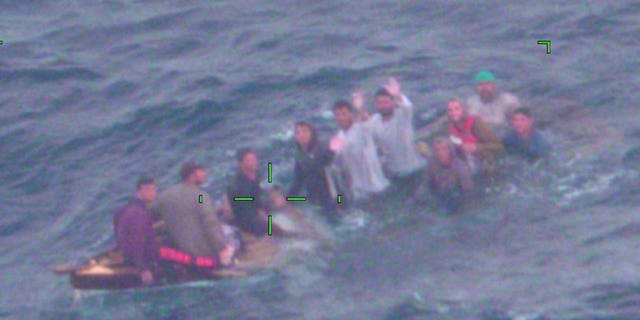 U.S. Coast Guard shows Cuban migrants on a sinking vessel spotted on Thursday, Feb. 3, 2022, about 40 miles off Key Largo, Fla. 
