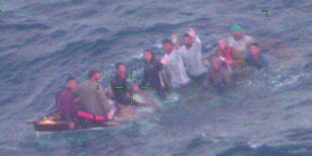 U.S. Coast Guard shows Cuban migrants on a sinking vessel spotted on Thursday, Feb. 3, 2022, about 40 miles off Key Largo, Fla. 