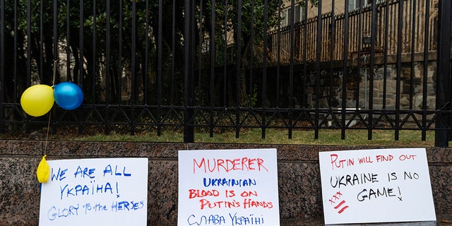 Signs during a protest against the Russian invasion of Ukraine outside the Russian Embassy in Washington, D.C., U.S., on Thursday, Feb. 24, 2022. 