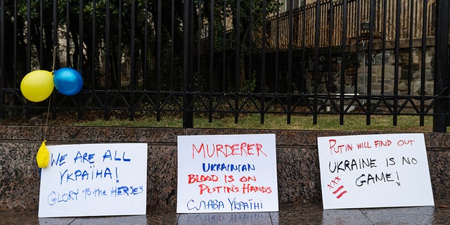 Signs during a protest against the Russian invasion of Ukraine outside the Russian Embassy in Washington, D.C., U.S., on Thursday, Feb. 24, 2022.
