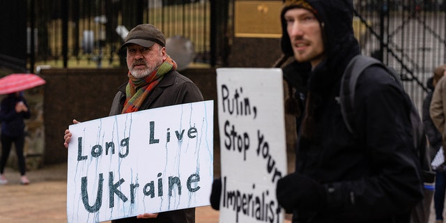 Demonstrators during a protest against the Russian invasion of Ukraine outside the Russian Embassy in Washington, D.C., U.S., on Thursday, Feb. 24, 2022. 
