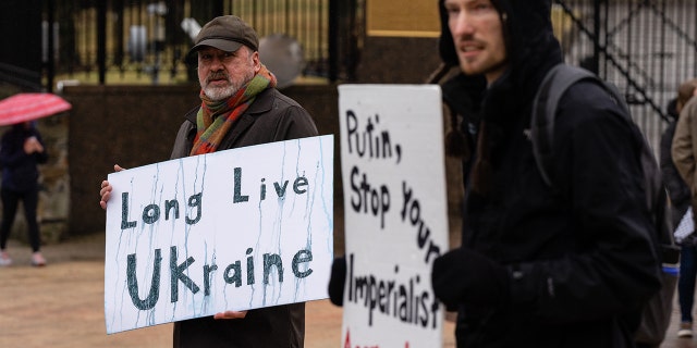 Demonstrators during a protest against the Russian invasion of Ukraine outside the Russian Embassy in Washington, D.C., U.S., on Thursday, Feb. 24, 2022.
