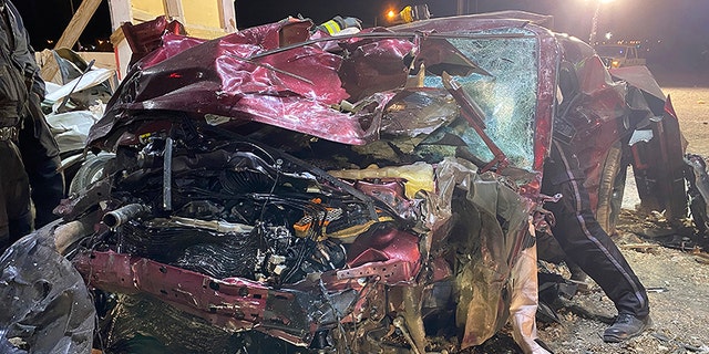 This photo released by the North Las Vegas Police Department shows a Dodge Challenger in North Las Vegas on Saturday, Jan. 29, 2022. Las Vegas police said the driver and his passenger were among the dead after Saturday's crash.