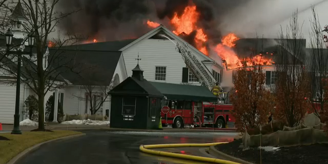 A fire tore through the Oakland Hills Country Club in Michigan Thursday morning, collapsing the storied structure's roof.